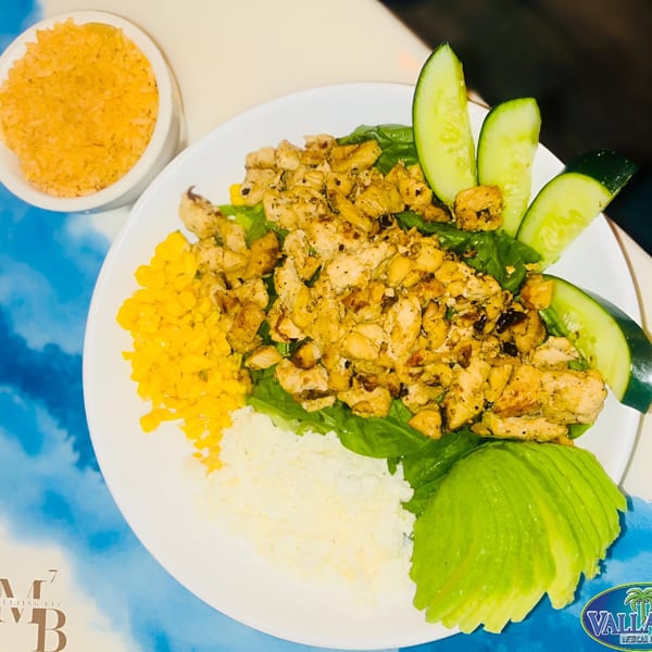 A Mexican chicken salad with corn, avocado, cucumber, and rice from Vallarta Mexican Grill.